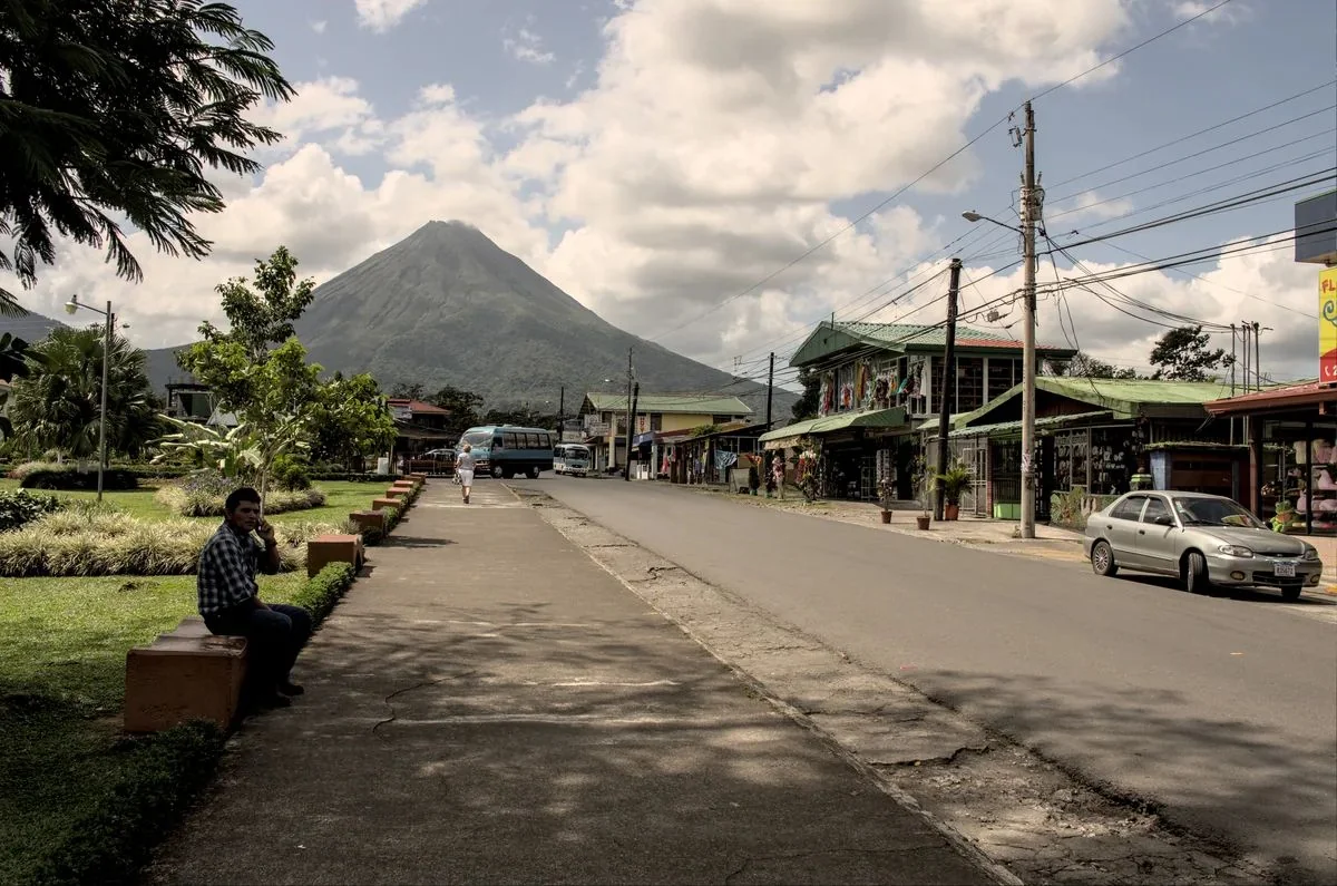 Arenal volcano rising above the town of La Fortuna Costa Rica on the hot springs comparison catalog